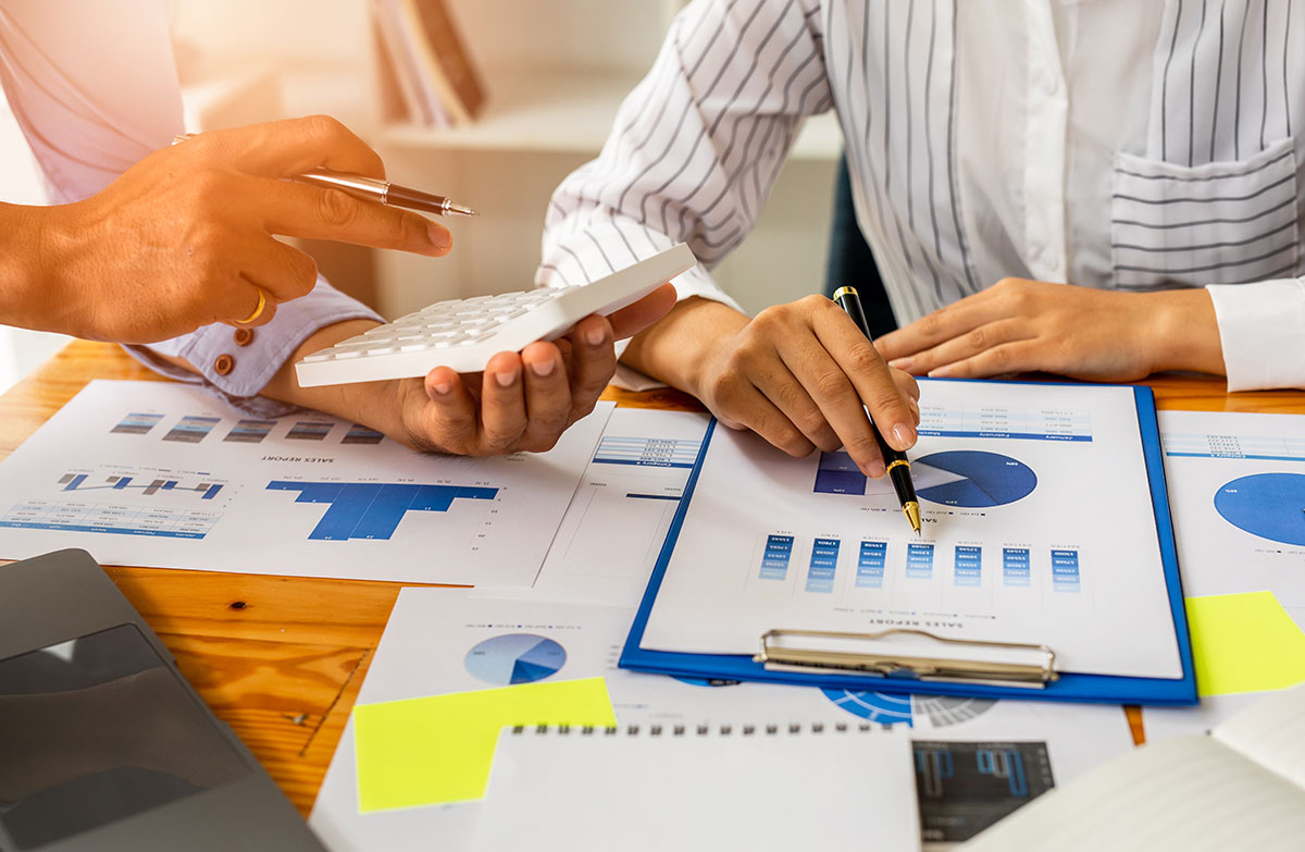 two business partners working together on data